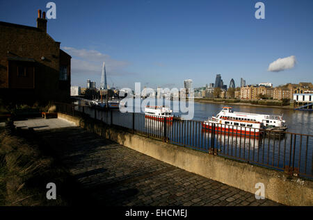 View from beside the Angel pub in Bermondsey up the River Thames to Tower Bridge, the Shard and the City of London, UK Stock Photo