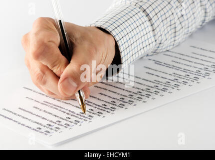 Close Up of Male Hand Holding Pen Taking True or False Test Stock Photo