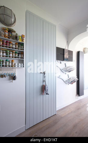 A closed cupboard door in a modern kitchen. Stock Photo