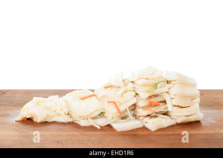 cutted Baek-gimchi on a wooden plate, isolated on white Stock Photo