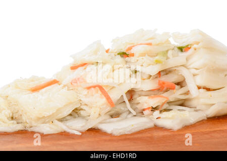 cutted Baek-gimchi on a wooden plate, isolated on white Stock Photo