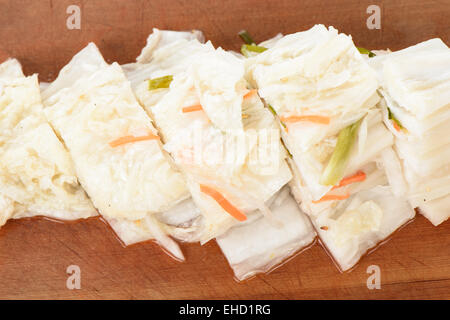 cutted Baek-gimchi on a wooden plate, Korean traditional food Stock Photo