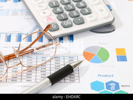 image of pen calculator and glasses on financial report Stock Photo