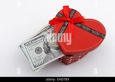 Love gift with US dollar bills (USD), in a red gift box. Stock Photo