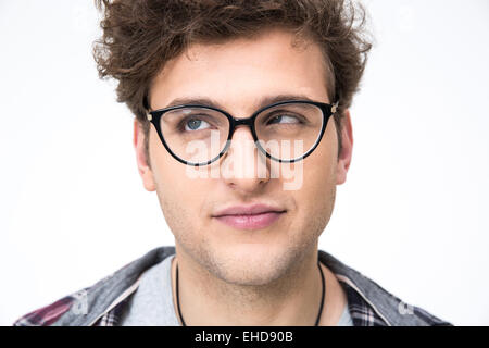 Closeup portrait of a funny man with curly hair over gray background Stock Photo