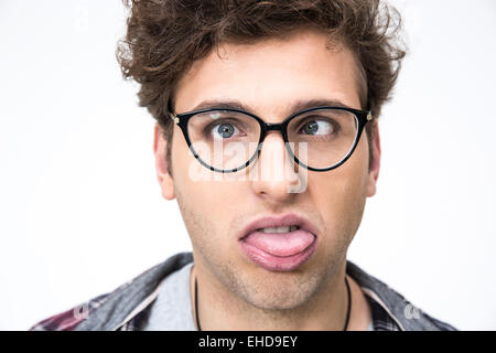 Closeup portrait of a funny young man over gray background Stock Photo