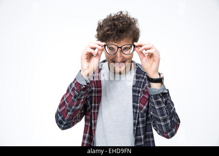 Happy young man looking through big glasses Stock Photo