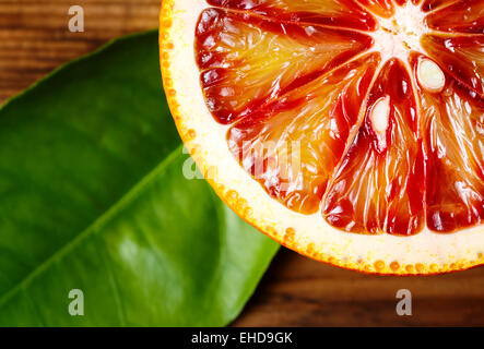 Blood orange fruit close up on wooden table. Top view. Stock Photo