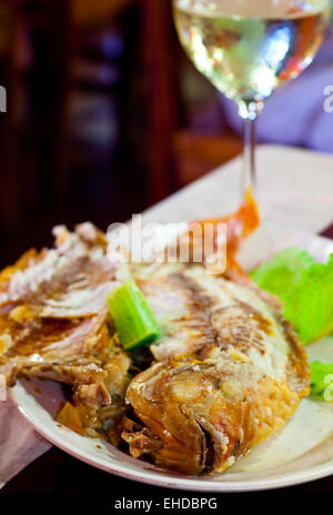 Fried fish on grill  in salt Stock Photo