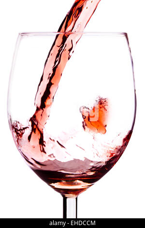 Red wine splash in glass on white Stock Photo