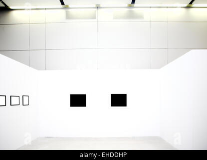 empty frames on white wall in museum Stock Photo