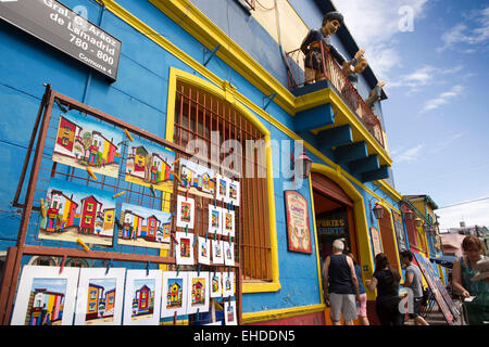 Argentina, Buenos Aires, La Boca, Caminito Tango tourist bar café, paintings for sale Stock Photo