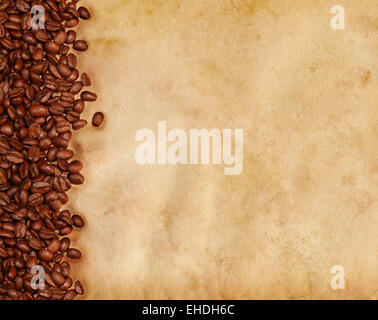 Coffee beans on old parchment paper Stock Photo