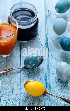 Easter eggs painted with natural dye: red cabbage and tumeric Stock Photo