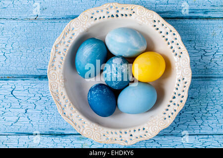 Easter eggs painted with natural dye: red cabbage and tumeric Stock Photo