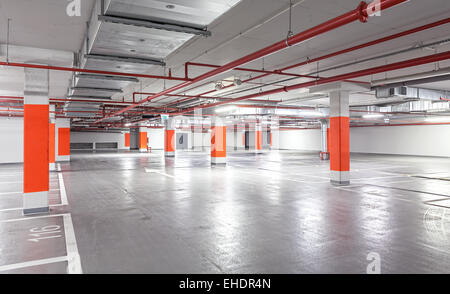 Photo of underground parking, industrial interior background. Stock Photo