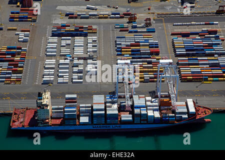 Container ship at Thorndon Container Terminal, Wellington, North Island, New Zealand - aerial Stock Photo