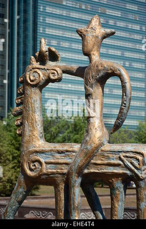 Bronze statue in abstract style featuring a rider on horseback - in the street of Astana, Kazakhstan Stock Photo