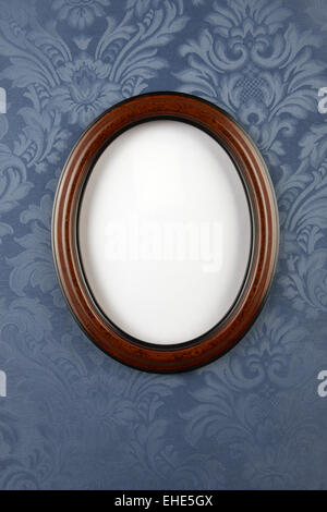 Dark wood oval wall frame Stock Photo