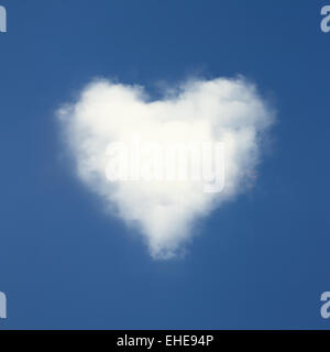 Heart shaped clouds on blue sky background. Stock Photo
