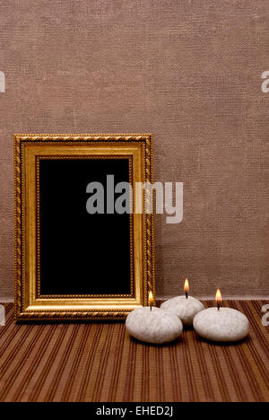Empty picture frame with candles Stock Photo