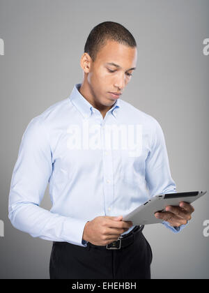 Man using Apple iPad tablet computer Stock Photo