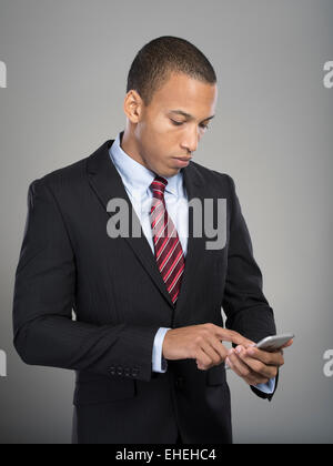 Businessman using Apple iphone Stock Photo