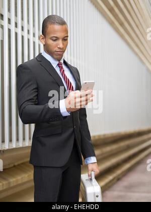 Businessman using Apple iphone Stock Photo