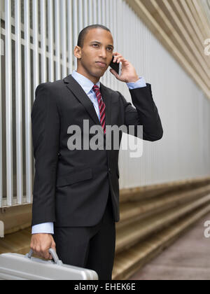 Businessman using Apple iphone Stock Photo