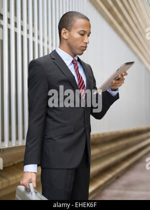 Man using Apple iPad tablet computer Stock Photo