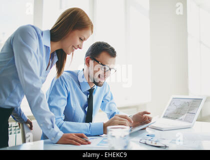 Two colleagues using touchpad Stock Photo