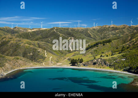 Te Ikaamaru Bay, and Makara Wind Farm (Project West Wind) Wellington, North Island, New Zealand - aerial Stock Photo
