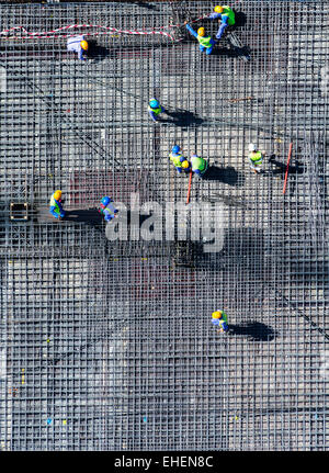 Migrant workers on construction site of apartment skyscraper tower in Dubai United Arab Emirates Stock Photo