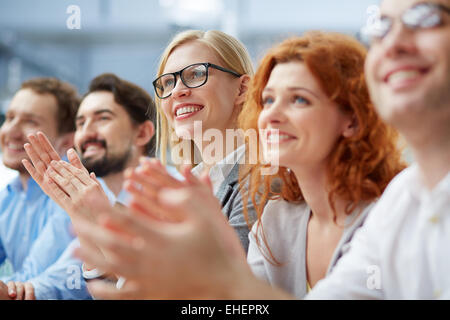 Row of business people sitting at seminar Stock Photo