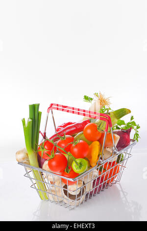 Assortment of fresh vegetables in basket Stock Photo