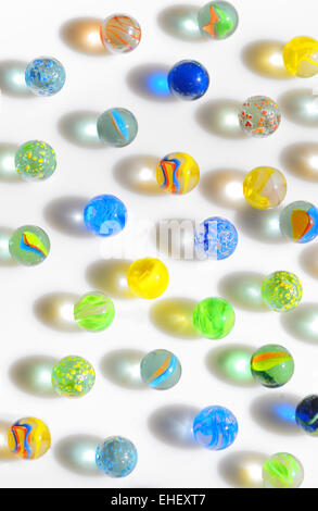 Colorful different Marbles on white background Stock Photo