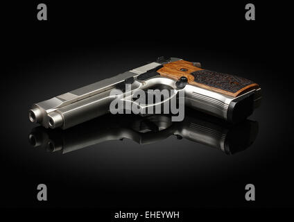 Chromed handgun on black background with reflection Stock Photo
