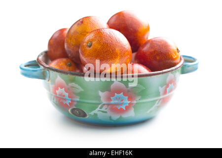 blood red oranges in bowl Stock Photo
