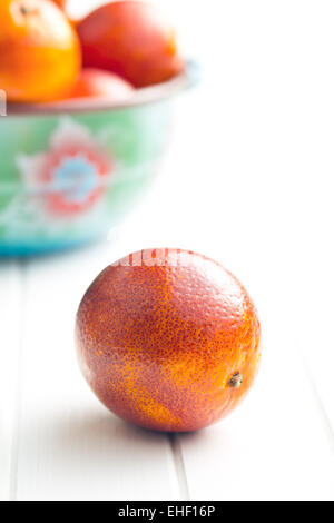 blood red oranges on kitchen table Stock Photo