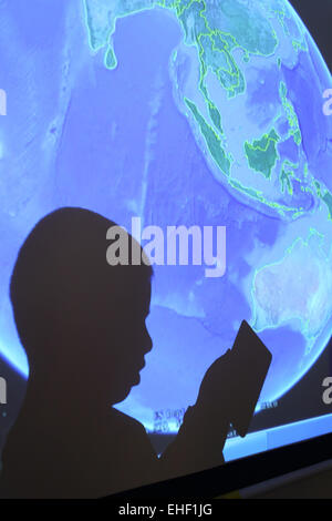 The boy in the use of flat panel computer Stock Photo