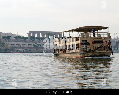 the local ferry crossing the Nile departing from landing stage in front of Luxor Temple, Luxor, Upper Egypt Stock Photo