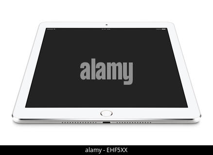 Angled front view of white tablet computer with blank screen mockup on the surface, isolated on white background. Stock Photo