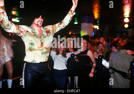 Guy in fancy dress in a nightclub on The Big Market in Newcastle. Stock Photo