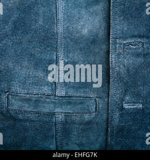 Old worn suede vest fragment with side pocket Stock Photo