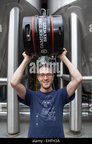 Staff Member Holding Beer Barrel at the Camden Town Brewery London Stock Photo