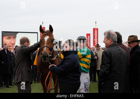 Cheltenham, UK. 12th March, 2015. Winners presentation with A P McCoy and John Patrick (J. P.) McManus (Irish businessman and racehorse owner) after winning the Ryanair Chase (Registered As The Festival Trophy Steeple Chase) Grade 1 with Uxizandre. Credit: Lajos-Eric Balogh/turfstock. Credit:  dpa picture alliance/Alamy Live News Stock Photo