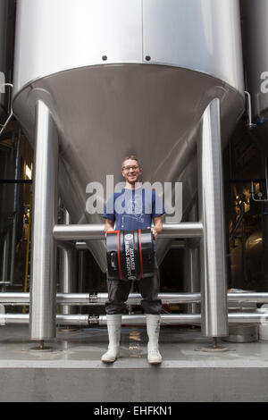 Staff Member Holding Beer Barrel at the Camden Town Brewery London Stock Photo