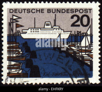 GERMANY - CIRCA 1960s: A stamp printed in Germany shows harbor with ship and yachts Stock Photo