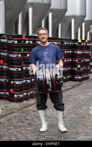 Staff holding Beer Barrel at the Camden Town Brewery London Stock Photo