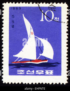 DPRK - CIRCA 1965: A stamp printed in DPRK (North Korea) shows yacht in a sea Stock Photo